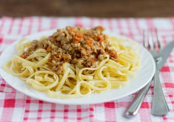 pasta,delicious spaghetti with Bolognese sauce on wooden background
