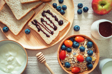 Breakfast Healthy Nature Vegetarian Food With Yogurt, Milk, Granola, Muesli and Natural Fresh Fruit on The Table.,Granola and Yogurt for Diet Eating for Healthcare Concept., Homemade Nutrition Food.