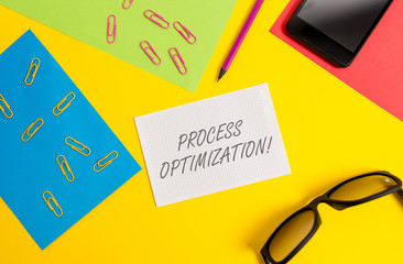 Text sign showing Process Optimization. Business photo text Improve Organizations Efficiency Maximize Throughput Paper sheets pencil clips smartphone eyeglasses notebook color background