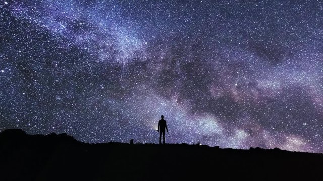 Timelapse of a climber looking at stars