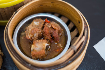 Closeup of Dim Sum in bamboo steamer, Chinese cuisine.