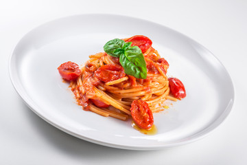 Plate of spaghetti with tomato and basil