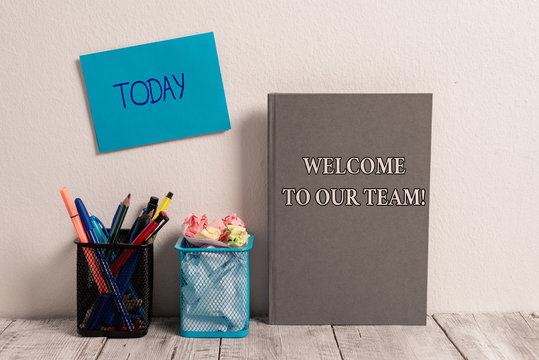 Handwriting text Welcome To Our Team. Conceptual photo introducing another demonstrating to your team mates Empty Sticky Card on Wall Two Mesh Pencil Pots Grey Hardcover Notebook