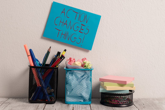 Conceptual Hand Writing Showing Action Changes Things. Concept Meaning Start Doing Something Against Problem Resolve Or Achieve It Blue Sticky Card On Wall Two Pencil Pots Mesh Paperclip Notes