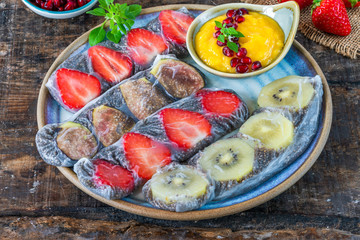 Chia seeds and fruit rice paper rolls with mango dipping sauce