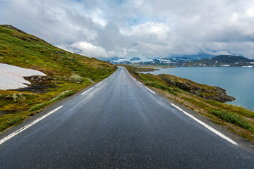 Touristic road 55 seen in Oppland direction, Plesteinvatnet lake is at right. Sogn og Fjordane, Norway.