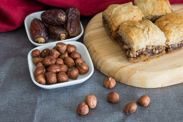 Turkish style vegan baklava or Antep baklava with nut,date fruit, pistachio for presentation and service and food photography. 