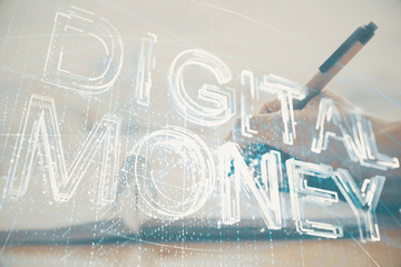 Cryptocurrency hologram over hands taking notes background. Concept of blockchain. Multi exposure