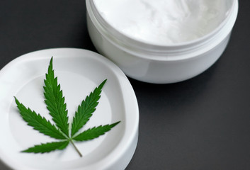 Cannabis ointment natural product. Cosmetic jar cream from natural hemp, lotion with CBD content. Copy space for your design
