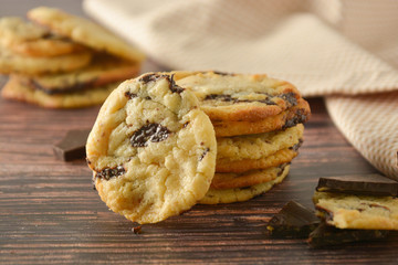 Homemade chocolate cookies on wooden table.