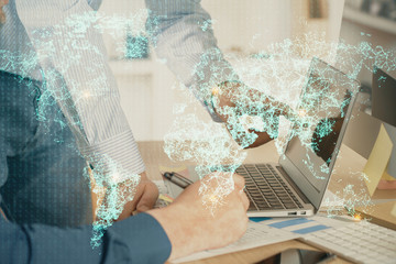 Fototapeta na wymiar Social network theme hologram with businessman working on computer on background. Multi exposure.