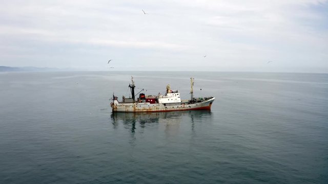 Aerial of a rusty trawler fishing Russian ship in the Black Sea