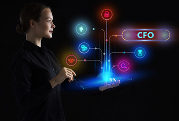 The concept of business, technology, the Internet and the network. A young entrepreneur working on a virtual screen of the future and sees the inscription: CFO