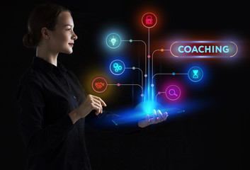 The concept of business, technology, the Internet and the network. A young entrepreneur working on a virtual screen of the future and sees the inscription: Coaching