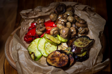 Mushrooms champignons and grilled vegetables: pepper, zucchini, tomatoes. Catering healthy food