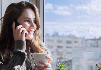 beautiful young woman talking on smartphone