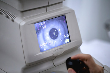 Ophthalmologist checks the eyes. Iris scanner.