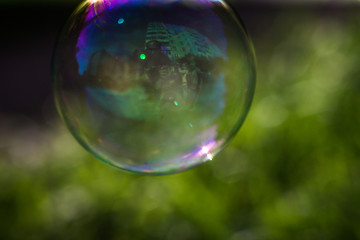 Reflection in a flying soap bubble