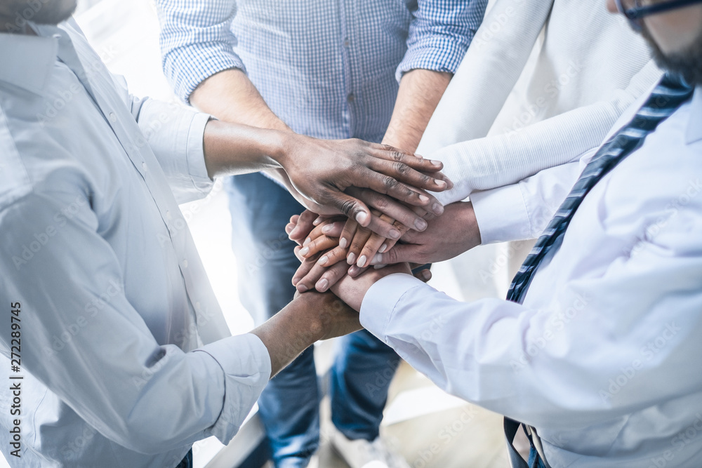 Wall mural stack of hands. unity and teamwork concept.