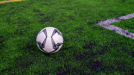 Fototapeta na wymiar soccer ball on green field, football on green field