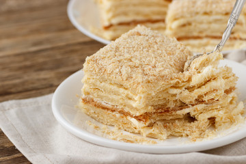 Piece of cake Napoleon puff pastry with custard cream. Close up.