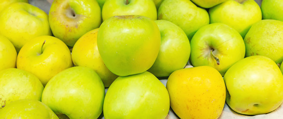 green apples in the store on the counter