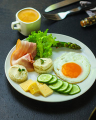 healthy food - breakfast (scrambled eggs, bacon, lettuce, asparagus, cucumbers, cheese, sandwich). food background. top view. copy space
