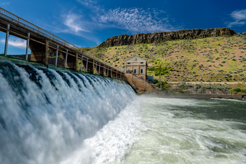 Obraz premium White water flows over Diversion Dam on the Boise River in the spring