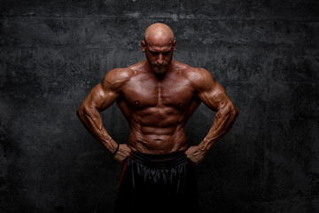 Fototapeta na wymiar Strong Muscular Men Posing, Flexing Muscles
