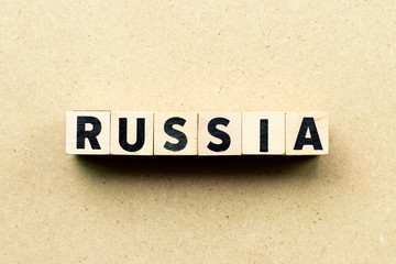 Obraz premium Letter block in word russia on wood background