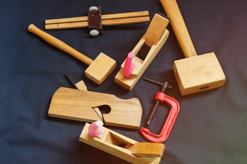 Woodworking. Joiner's works. Joiner's tools on dark background