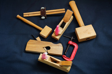 Woodworking. Joiner's works. Joiner's tools on dark background