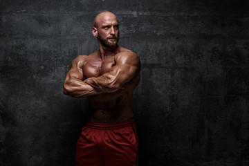 Fototapeta na wymiar Strong Muscular Men Posing, Flexing Muscles