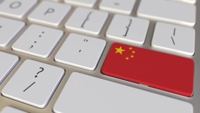 Key with flag of the Dominican Republic on the computer keyboard switches to key with flag of China, translation or relocation related animation