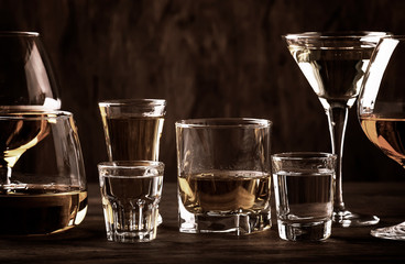 Strong Spirits Set. Hard alcoholic drinks in glasses in assortment: vodka, cognac, tequila, brandy and whiskey, grappa, liqueur, vermouth, tincture, rum. 