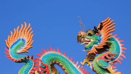 Fototapeta na wymiar fantasy Animals. Colorful Ceramic Dragon Decoration On Shrine Roof