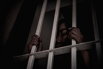 Hands of women desperate to catch the iron prison,prisoner concept,thailand people,Hope to be...