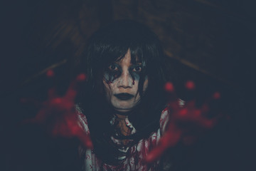 Portrait of asian woman make up ghost face,Horror scene,Scary background,Halloween poster