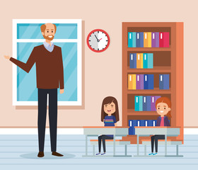man teacher with kids in the classroom and bookcase
