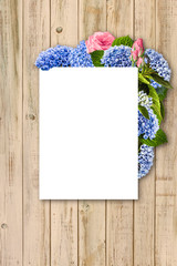 Obraz premium Floral frame with hydrangea, rose and leaves. For wedding, valentine's day, birthday. wooden background