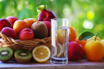 basket fruit and glass of water