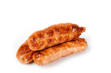 Meat sausages with glitter on a light background. Fried sausage. The concept of traditional cuisine.