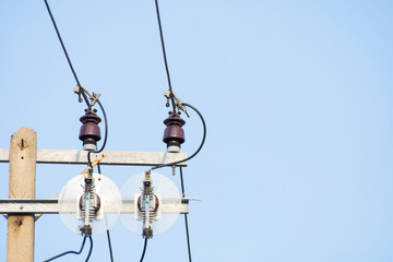 Obraz premium Top of Electric pole with wire on sky background.