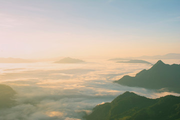 landscape nature of a great green mountain ridge, its tip is along the range behind the fog fog...