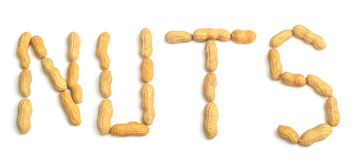 Text aus Erdnüssen freigestellt auf weißem Hintergrund. Erdnüsse geformt zu einem Text. Buchstaben aus Erdnüssen, Ernusstext.  - 272298512