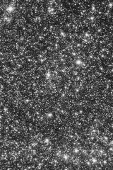 blur glitter or bokeh festive background,  texture black silber color. Xmas abstract background with copy space.