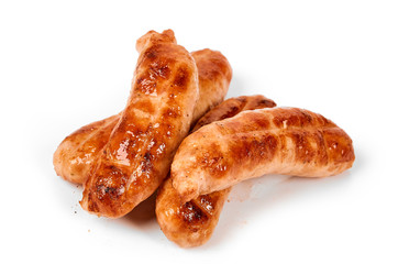 Meat sausages with glitter on a light background. Fried sausage. The concept of traditional cuisine.