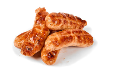 Meat sausages with glitter on a light background. Fried sausage. The concept of traditional cuisine.