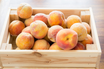 ripe peaches in container