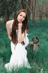 Girl with squirrel beside